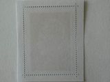 a close up of a piece of paper with stitching on it