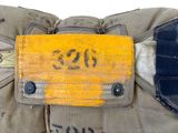 a close up of a military bag with a tag on it