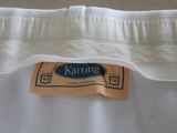 a close up of a white shirt with a label on it