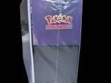 a purple box with a yellow pokemon logo on it