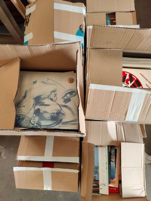 many boxes of books stacked on top of each other
