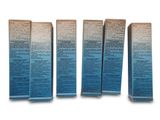 three boxes of blue and white toothpaste on a white surface