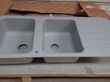 two sinks that are sitting on top of a table