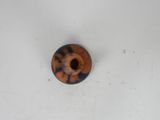 a brown and black object on a white surface
