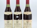 three bottles of wine sitting next to each other on a table
