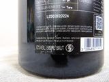 a close up of a bottle of wine on a table