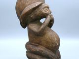 an image of a statue of a woman with a hat on her head