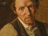 portrait of a man in a brown vest and white shirt