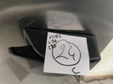 a sticker with a drawing of a dog on it sitting on a toilet