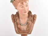 statue of a woman with a flower crown on her head