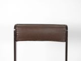 the back of a brown leather chair against a white background