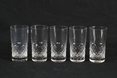six glasses are lined up in a row on a black background