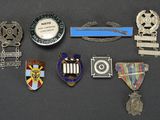 a lot of badges and medals on a table