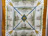a yellow and white scarf with a picture of a sailboat on it