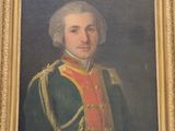 portrait d'un homme en uniforme militaire dans un cadre doré