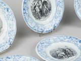 six blue and white plates with pictures of people on them