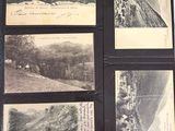 a black folder with pictures of mountains and a river