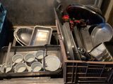 many pans and pans in a metal container