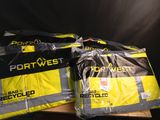 two bags of luggage sitting on top of a wooden pallet