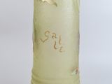 a glass vase with a flower in it on a table