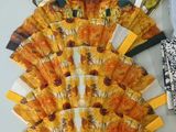 many different types of folded paper fans on a table