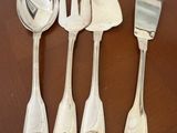 four forks and spoons sitting on a wooden table