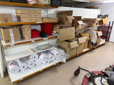many boxes of toilet paper on the shelves in the store