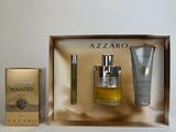 an image of a box containing a bottle of perfume and a tube of lotion