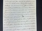 lettre manuscrite écrite à l'encre noire sur une feuille de papier