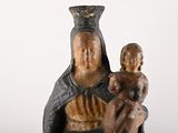 a statue of a woman holding a baby in her lap