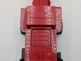 a red toy truck that is sitting on a white surface