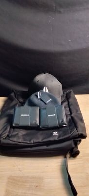 a bag with a hat on top of it on a table