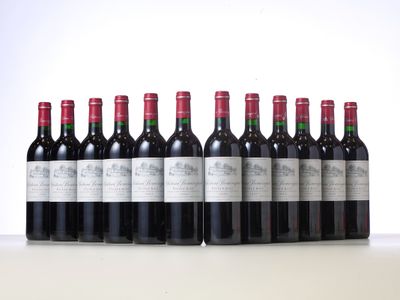 six bottles of red wine lined up in a row on a table