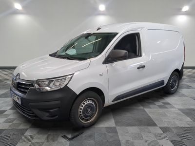the white van is parked on a checkered tile floor