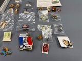 a table with a lot of pins and other items on it