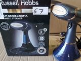 une boîte contenant un sèche-cheveux Russell Hobbs à côté de la boîte