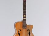 an image of a guitar hanging from a string
