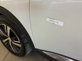 a sticker on the side of a white car