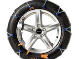a close up of a tire chain on a tire on a white background