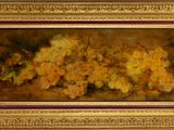 painting of a bunch of yellow flowers in a gold frame