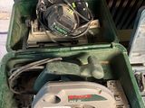a green box with a circular saw on top of it
