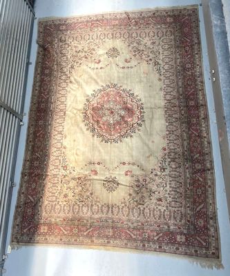 an image of a large oriental rug hanging on a wall