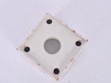 a white square with a hole in the middle