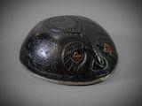 a close up of a helmet with a dragon on it