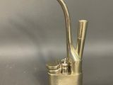 a metal pipe that is sitting on top of a table