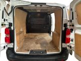 a white van with the back door open and the back door open