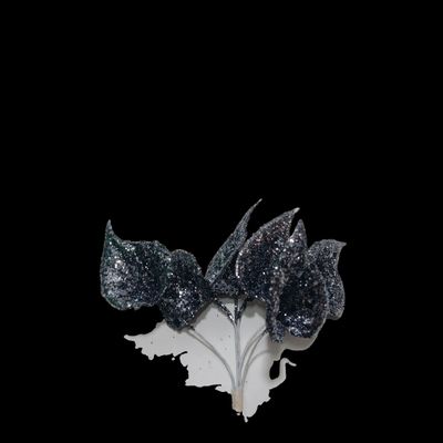 a black and white picture of a flower with glitter on it
