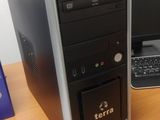 a desktop computer sitting on a desk next to a laptop computer