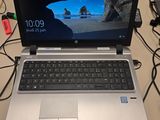 a laptop computer that is sitting on a desk