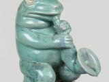 a statue of a frog with a hat on it ' s head